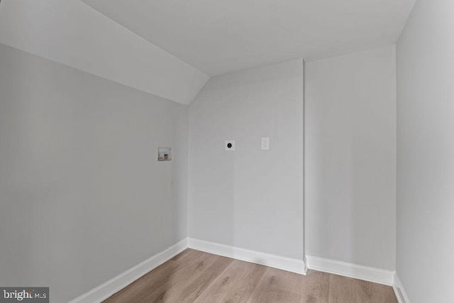 interior space featuring hookup for an electric dryer, light wood-type flooring, and washer hookup