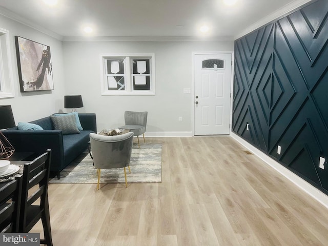 living room with crown molding and light hardwood / wood-style flooring