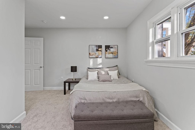 bedroom featuring light colored carpet