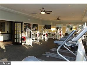 workout area featuring ornamental molding