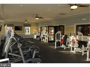 workout area featuring ornamental molding