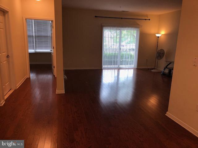 spare room featuring dark hardwood / wood-style flooring