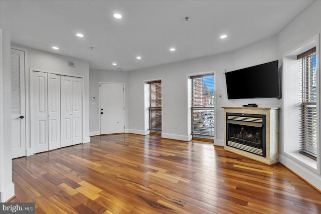 unfurnished living room featuring hardwood / wood-style flooring