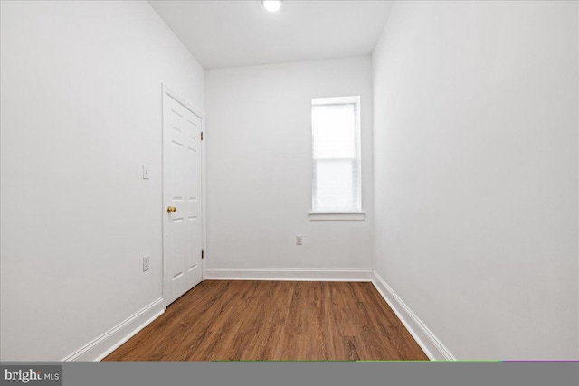 spare room featuring dark hardwood / wood-style flooring