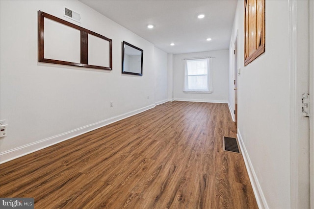 empty room featuring dark wood-type flooring