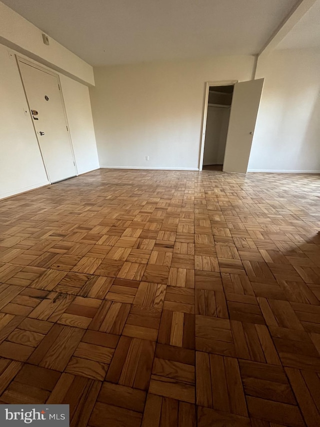 spare room with light parquet floors