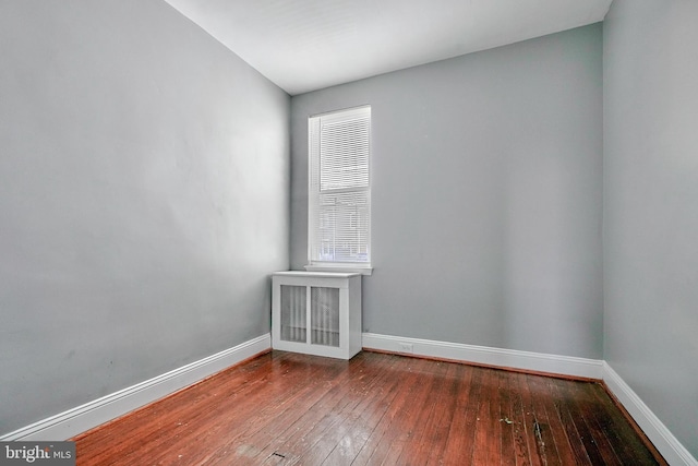 spare room featuring hardwood / wood-style floors