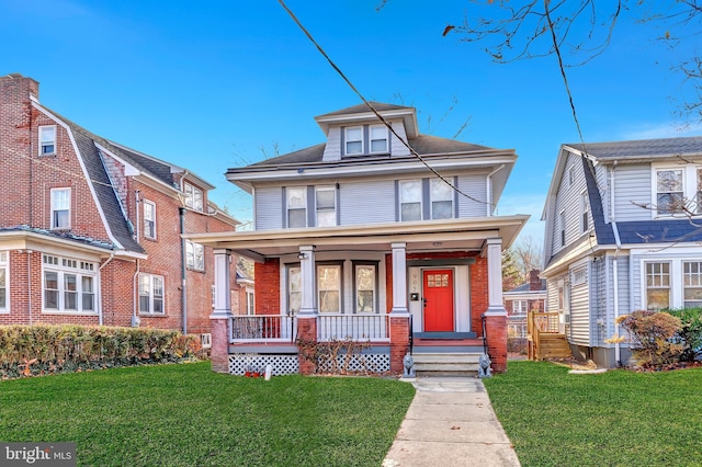 view of front facade with a porch and a front yard