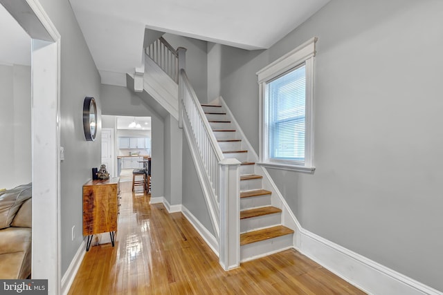 staircase featuring hardwood / wood-style flooring