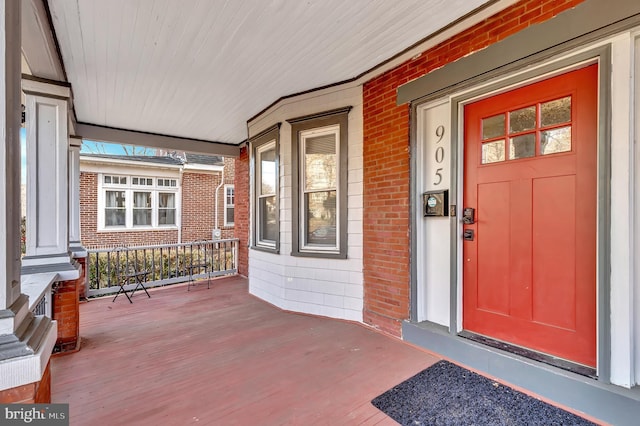 entrance to property featuring a porch