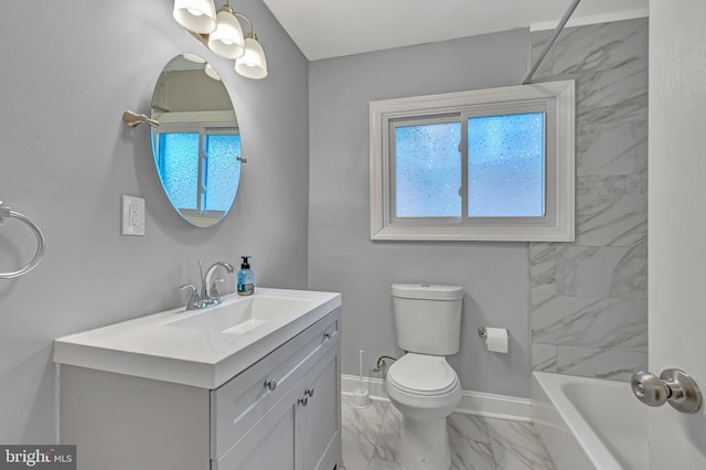 full bathroom with tiled shower / bath, vanity, and toilet