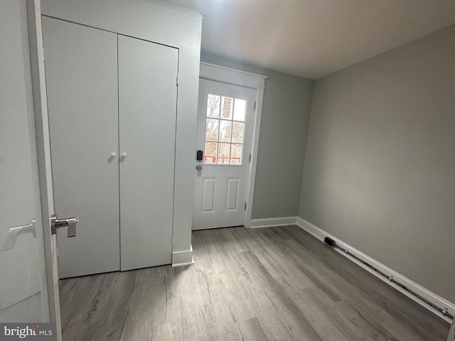 doorway to outside with light hardwood / wood-style flooring