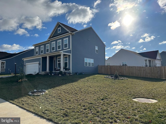 view of front of house with a garage and a front lawn