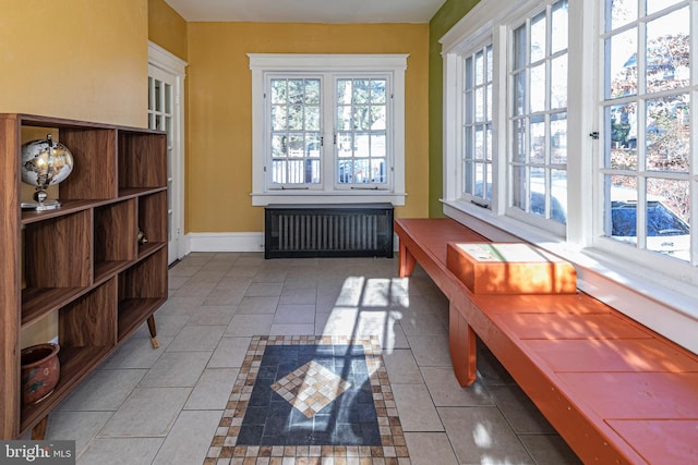 sunroom with radiator heating unit