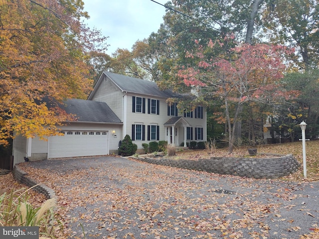 colonial inspired home with a garage