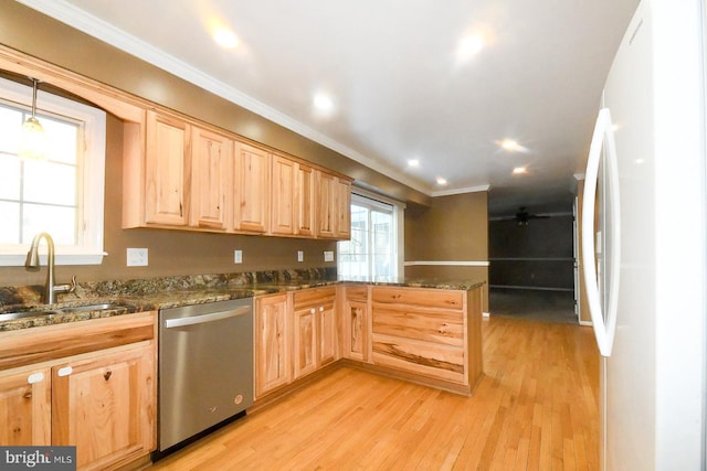 kitchen featuring light brown cabinetry, white fridge, stainless steel dishwasher, sink, and light hardwood / wood-style flooring