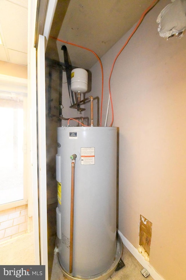 utility room with water heater