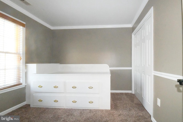 unfurnished bedroom featuring multiple windows, carpet flooring, and ornamental molding