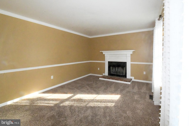 unfurnished living room featuring carpet and ornamental molding