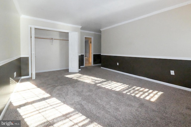 unfurnished bedroom featuring carpet floors, a closet, and ornamental molding