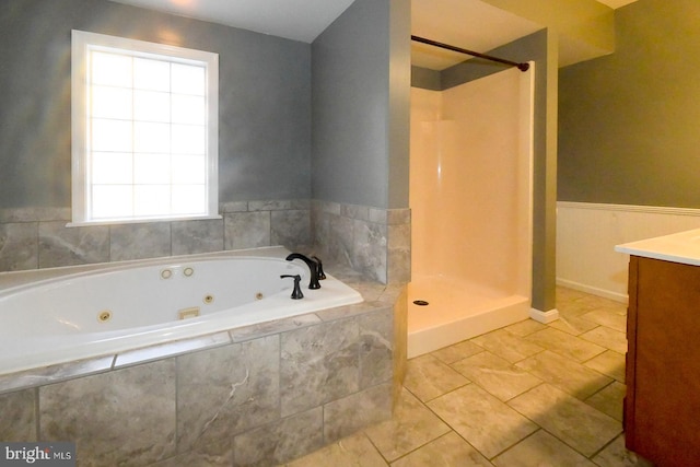 bathroom with independent shower and bath, tile patterned flooring, and vanity