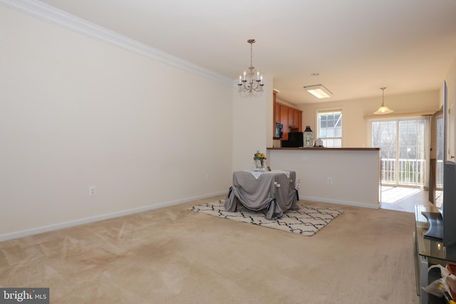 unfurnished dining area with a chandelier, crown molding, and light colored carpet