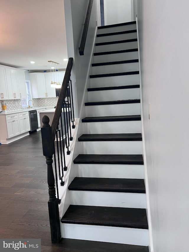 stairway with wood-type flooring