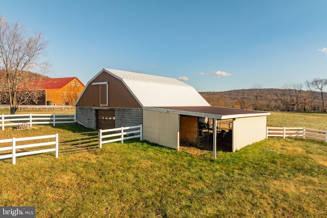 view of stable featuring a rural view