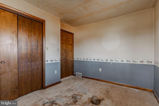 unfurnished bedroom with a closet