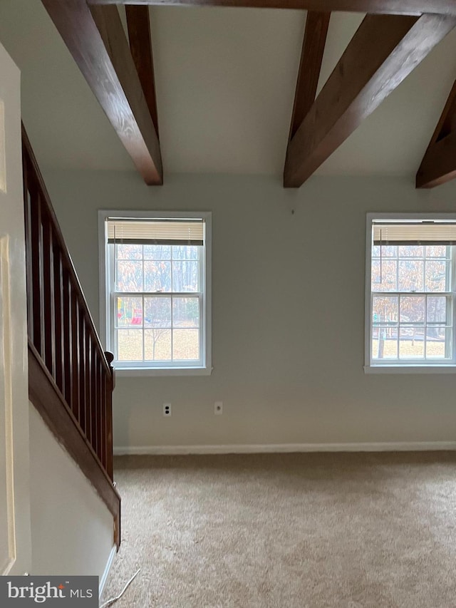 interior space with vaulted ceiling with beams