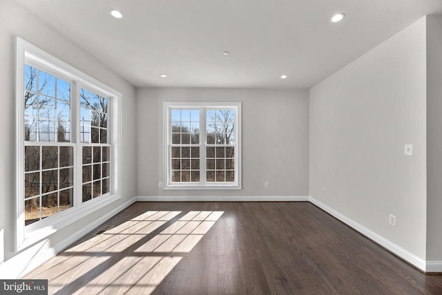 spare room featuring dark hardwood / wood-style floors