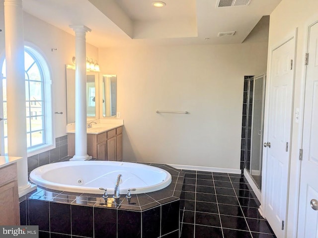 bathroom featuring separate shower and tub, a wealth of natural light, and vanity