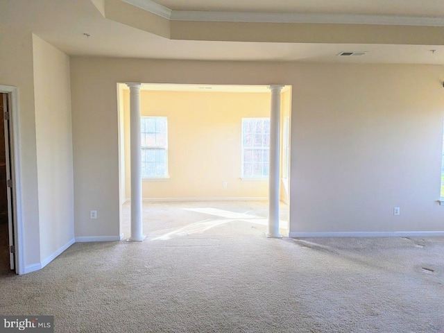 carpeted spare room featuring ornamental molding