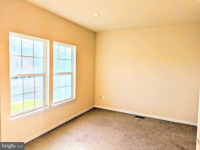 view of carpeted spare room