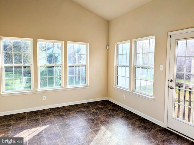 unfurnished sunroom featuring a wealth of natural light and lofted ceiling