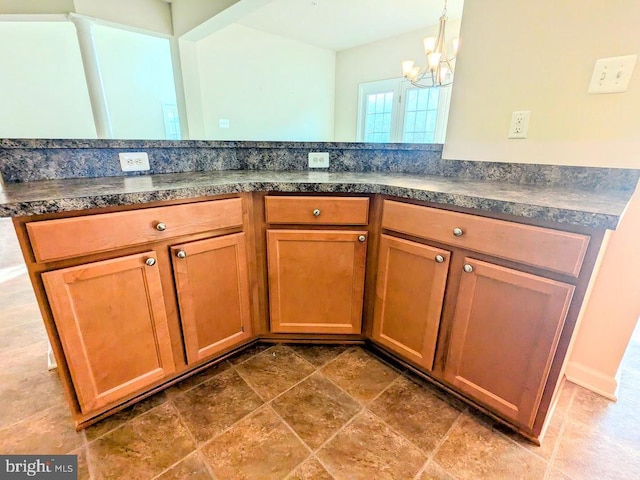 kitchen with hanging light fixtures and a chandelier