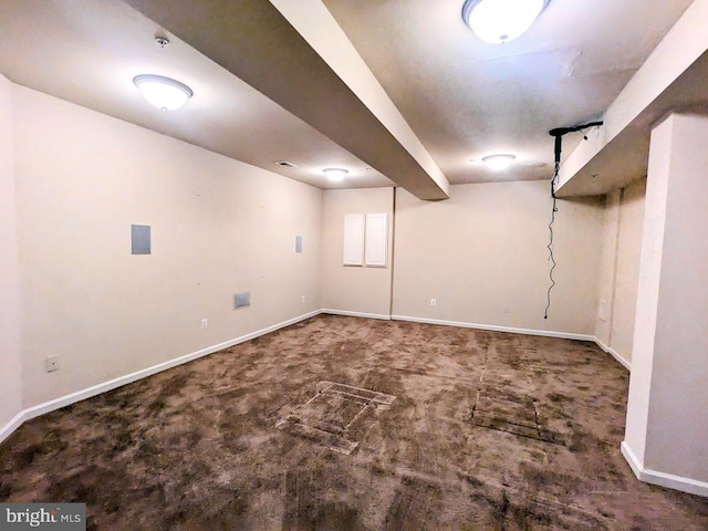 basement with dark colored carpet