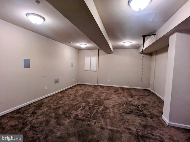 basement with dark colored carpet