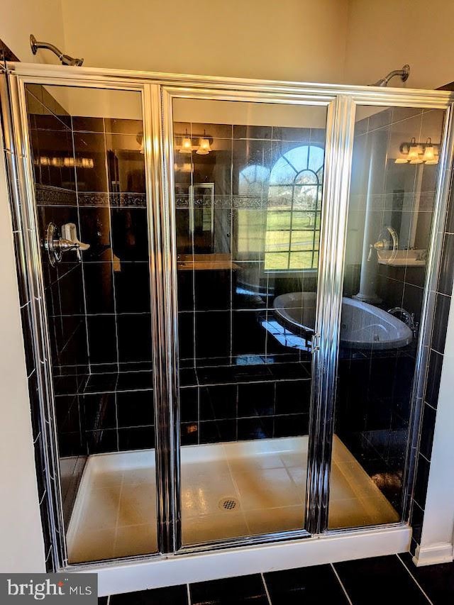 bathroom featuring tile patterned flooring and walk in shower