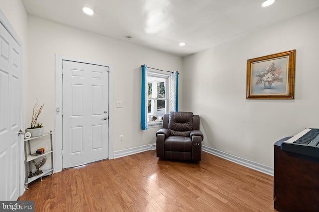 sitting room with light wood-type flooring