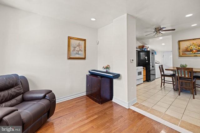 sitting room featuring ceiling fan and light hardwood / wood-style flooring