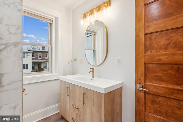 bathroom featuring vanity and wood-type flooring