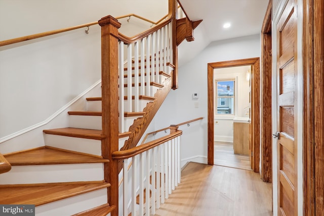 stairway featuring hardwood / wood-style flooring