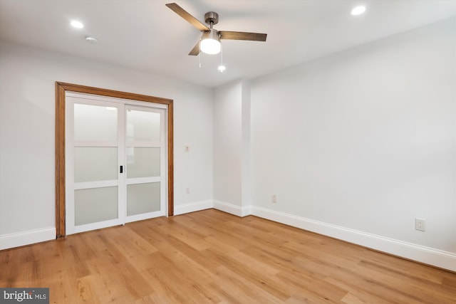 empty room with light hardwood / wood-style floors and ceiling fan