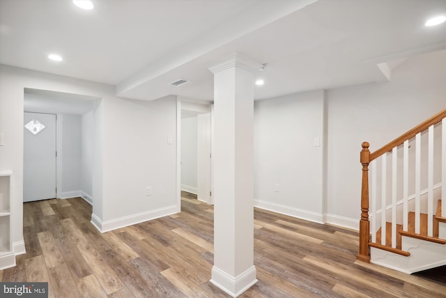 basement with light hardwood / wood-style floors