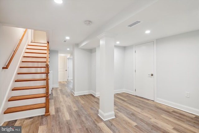 basement featuring light hardwood / wood-style flooring