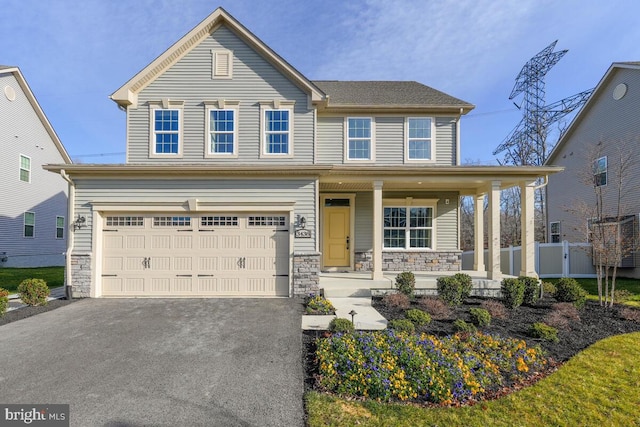 view of front facade with a porch and a garage