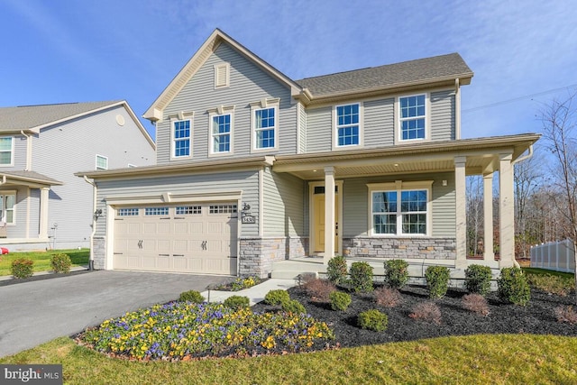 view of front of property featuring a garage