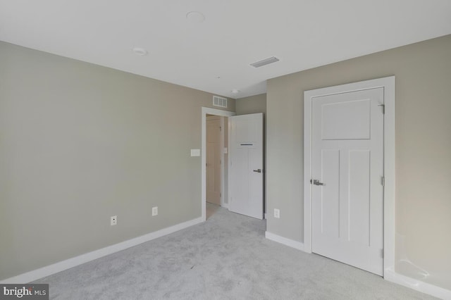 unfurnished bedroom with light carpet