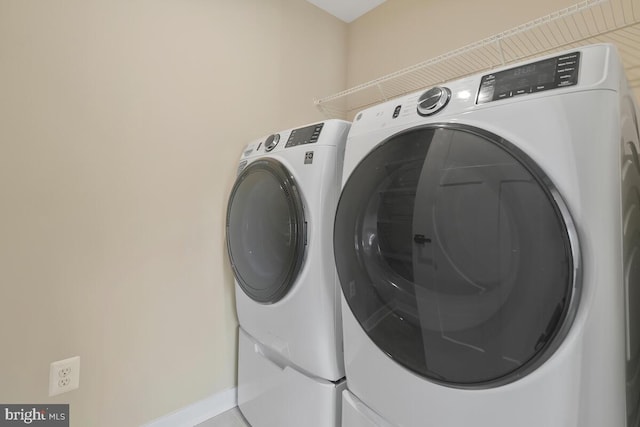 laundry room with separate washer and dryer